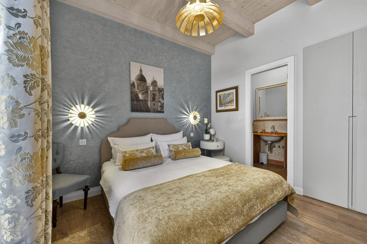 Wide view of the Deluxe Double Room at Dominus Little Palace with built-in wardrobe and en-suite bathroom
