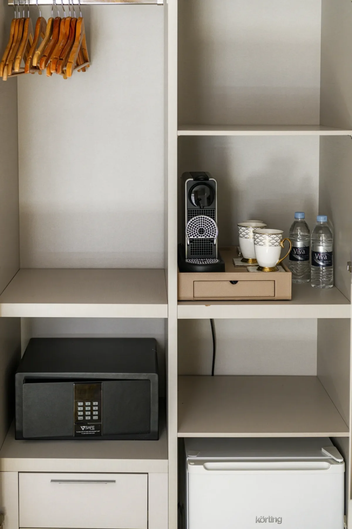 Executive Suite wardrobe with coffee station, in-room safe and minibar fridge