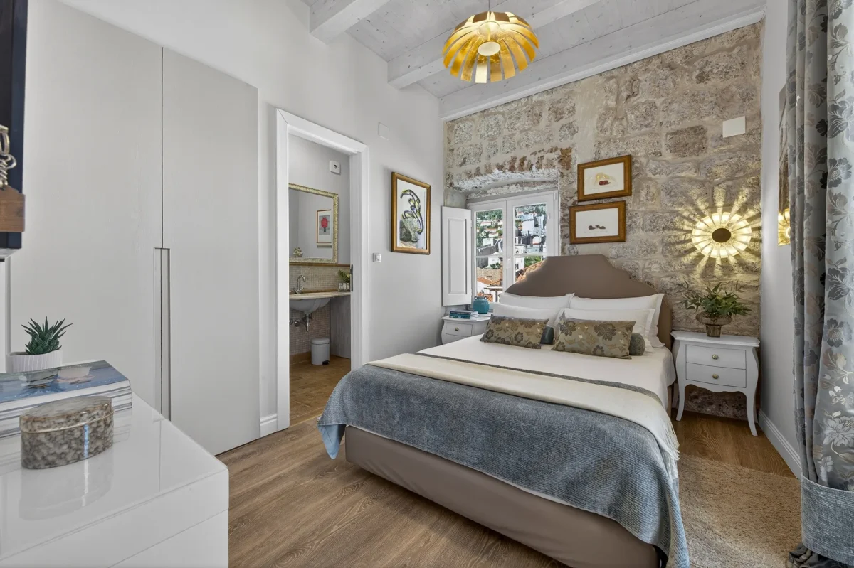 Premium Double Room at Dominus Little Palace in Dubrovnik Old Town with exposed stone wall, double bed and en-suite bathroom