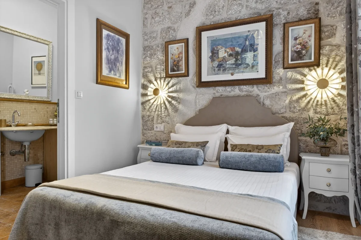 Premium Double Room at Dominus Little Palace with Dubrovnik watercolour above the bed and two sunburst wall lamps